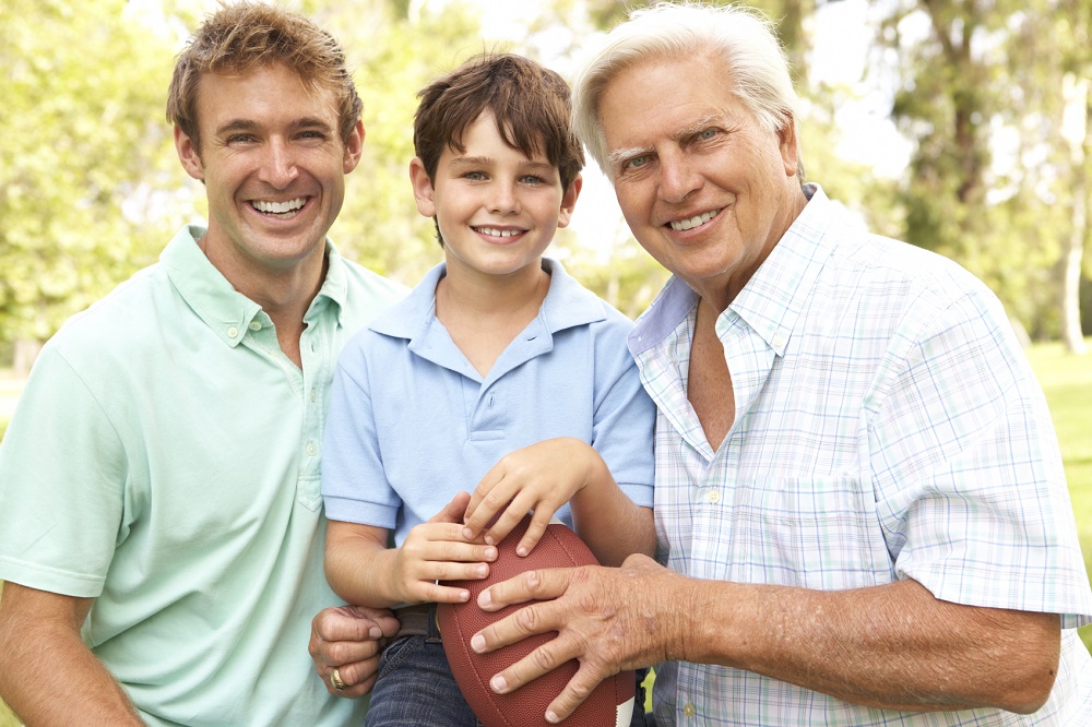 Common Sense Test Grandfather With Father And Son Playing American Football Togeth