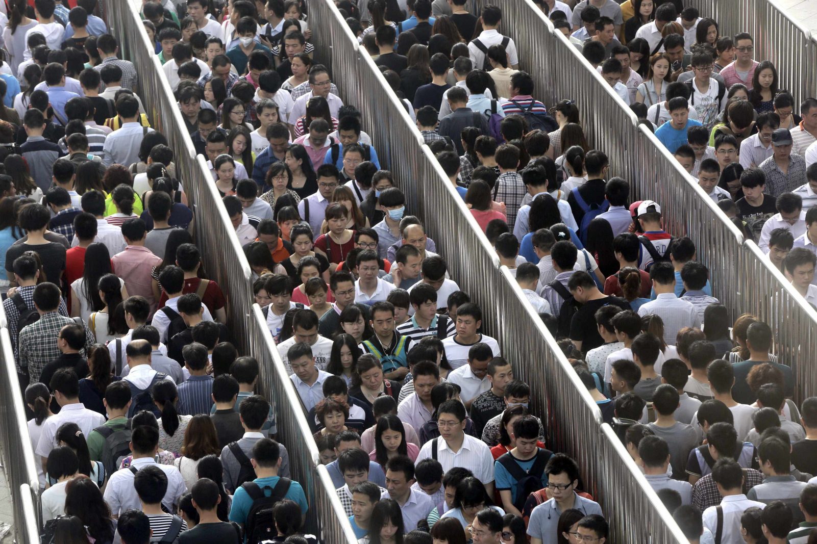 Can We Guess Your Age Based on This Anger Management Test? Passengers line up and wait for a security check during morning rush hour at Tiantongyuan North Station in Beijing