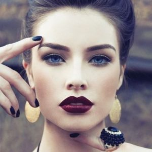 This Quiz Will Determine How Beauty Obsessed You Are Applying dark lipstick