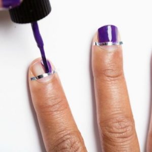 This Quiz Will Determine How Beauty Obsessed You Are Applying tape at the base of your nails before painting them