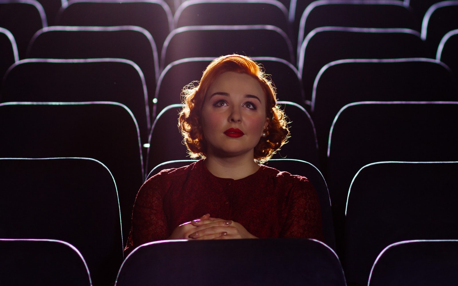 If You Know Your Movies, You Would Have No Problem Acing This Quiz Woman watching movie alone in cinema