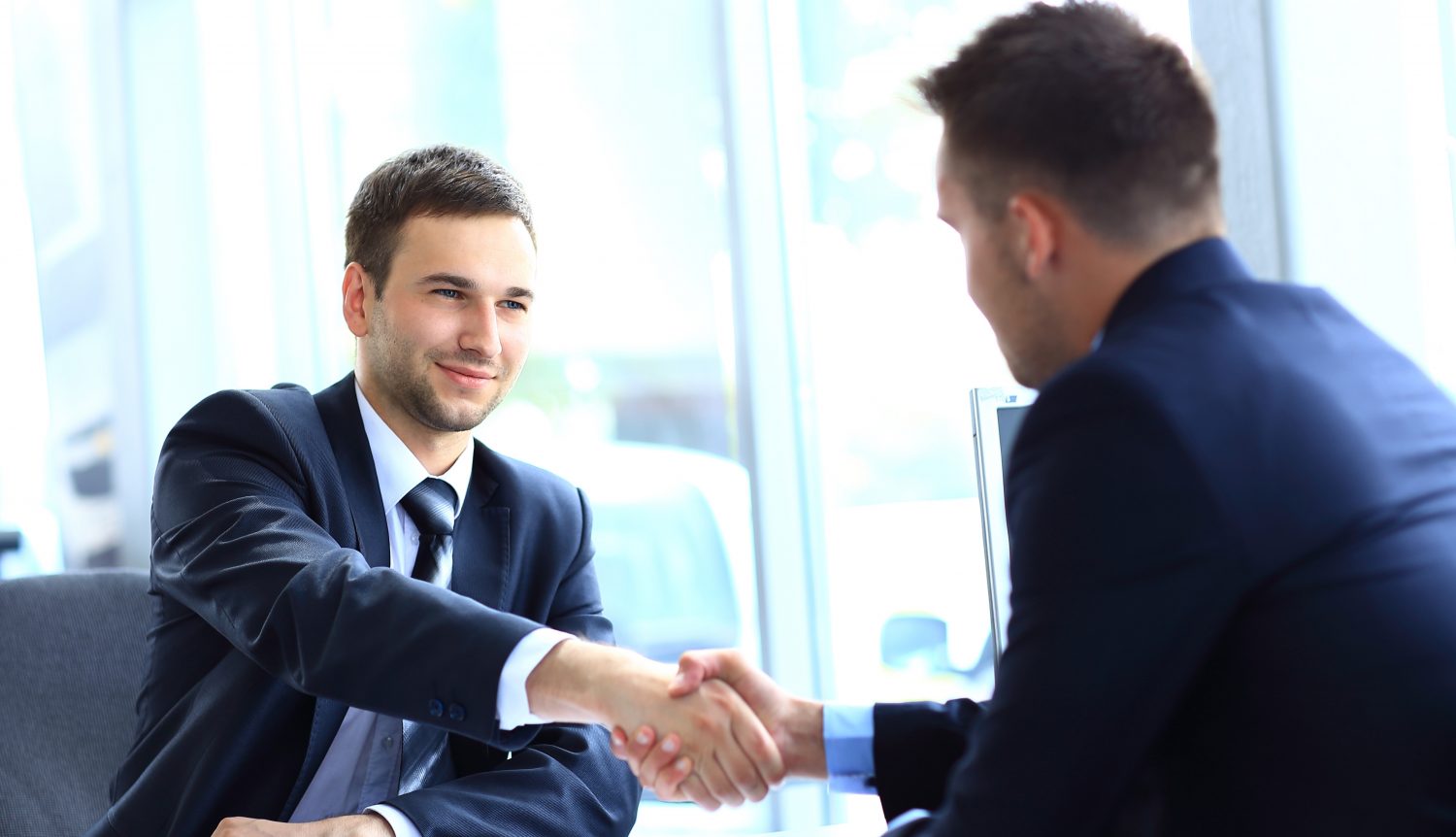 How Good Is Your French? businessman shaking hands