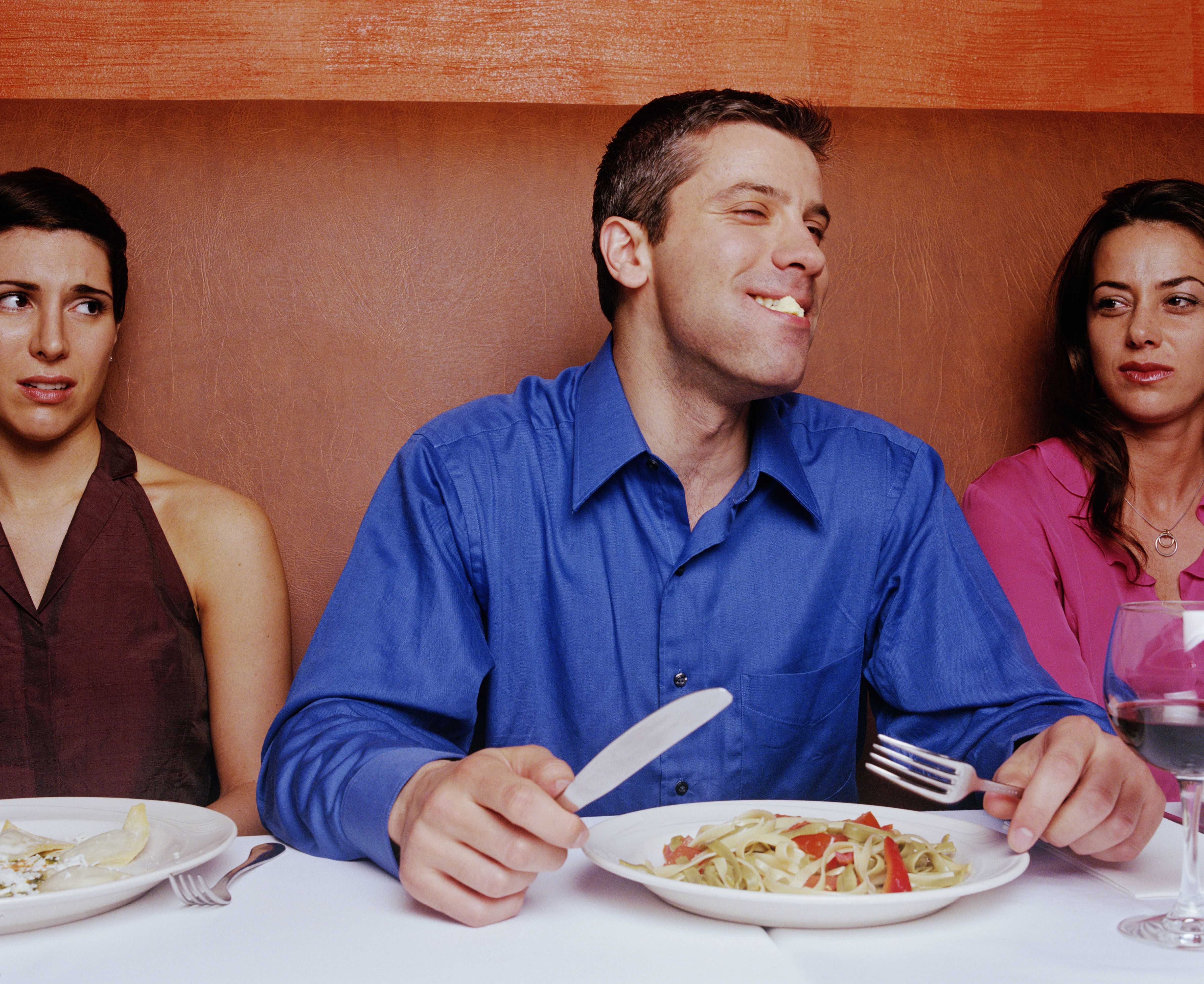 Tell Us How Much These Dating Pet Peeves Annoy You and We’ll Reveal What You Desire in a Man women in restaurant looking at man laughing with food in mouth 200070027 001 57751c7c3df78cb62cfe9603