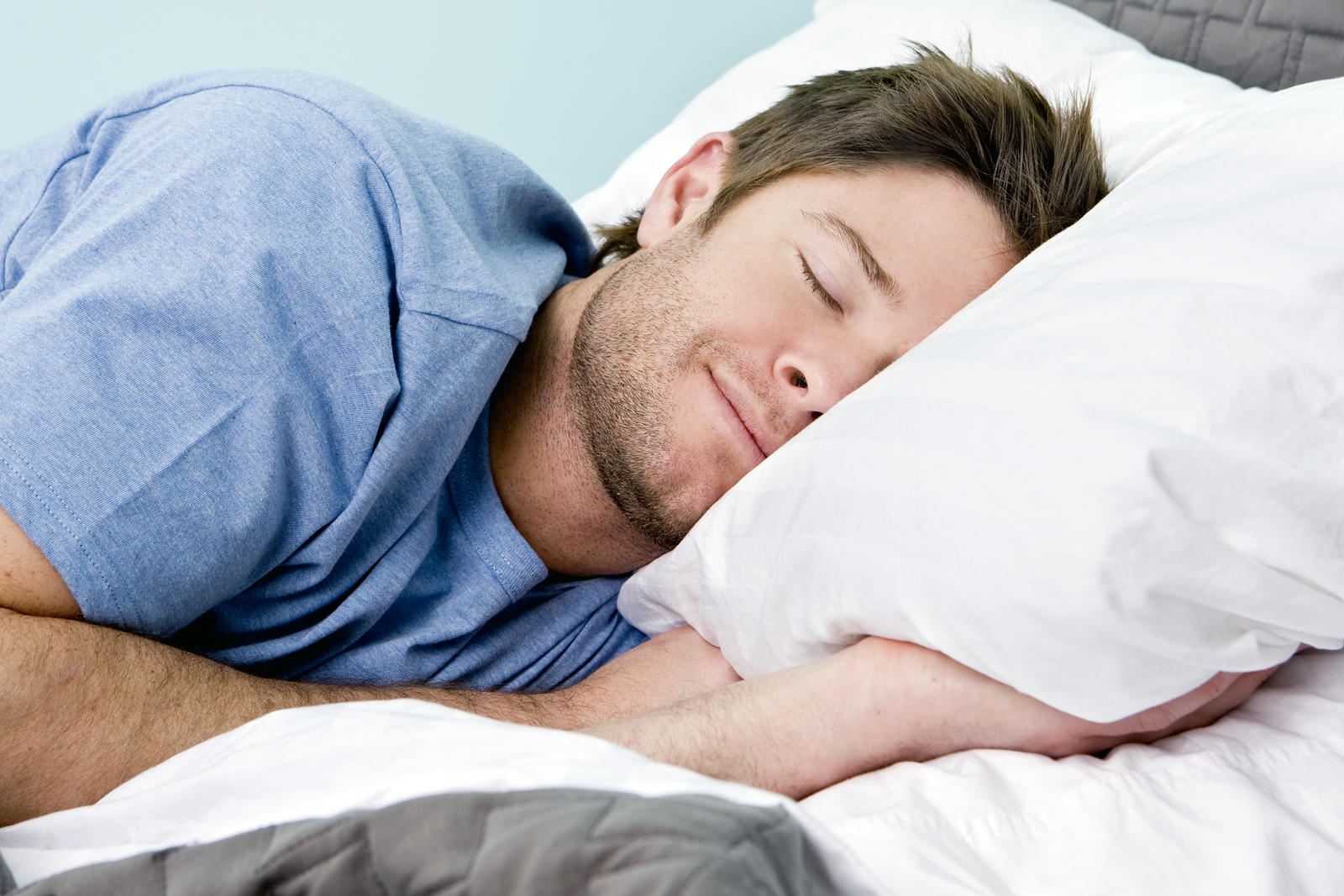 Are You the Child, Adult, Teen, Or Old Person of Your Friends? Man comfortably sleeping in his bed