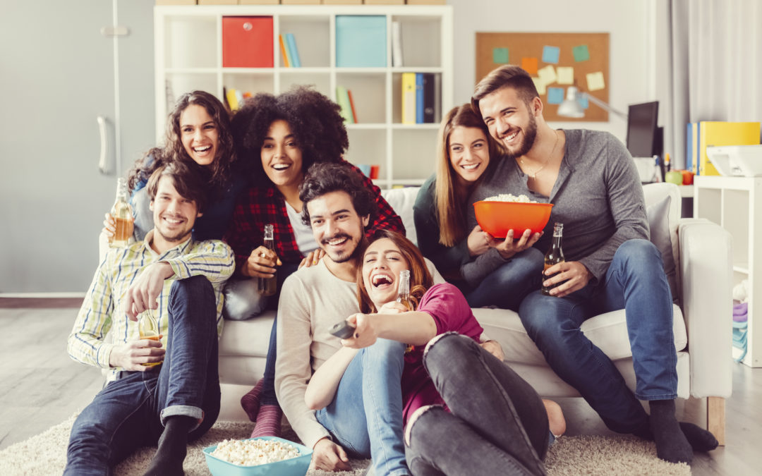 Are You the Child, Adult, Teen, Or Old Person of Your Friends? Group of friends watching tv