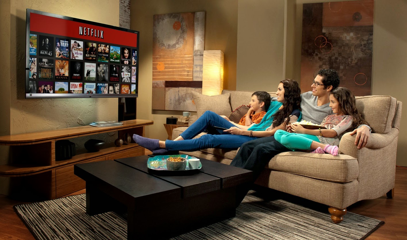Plan Your Netflix Binge and We’ll Reveal What the New Year Has in Store for You watching tv with family