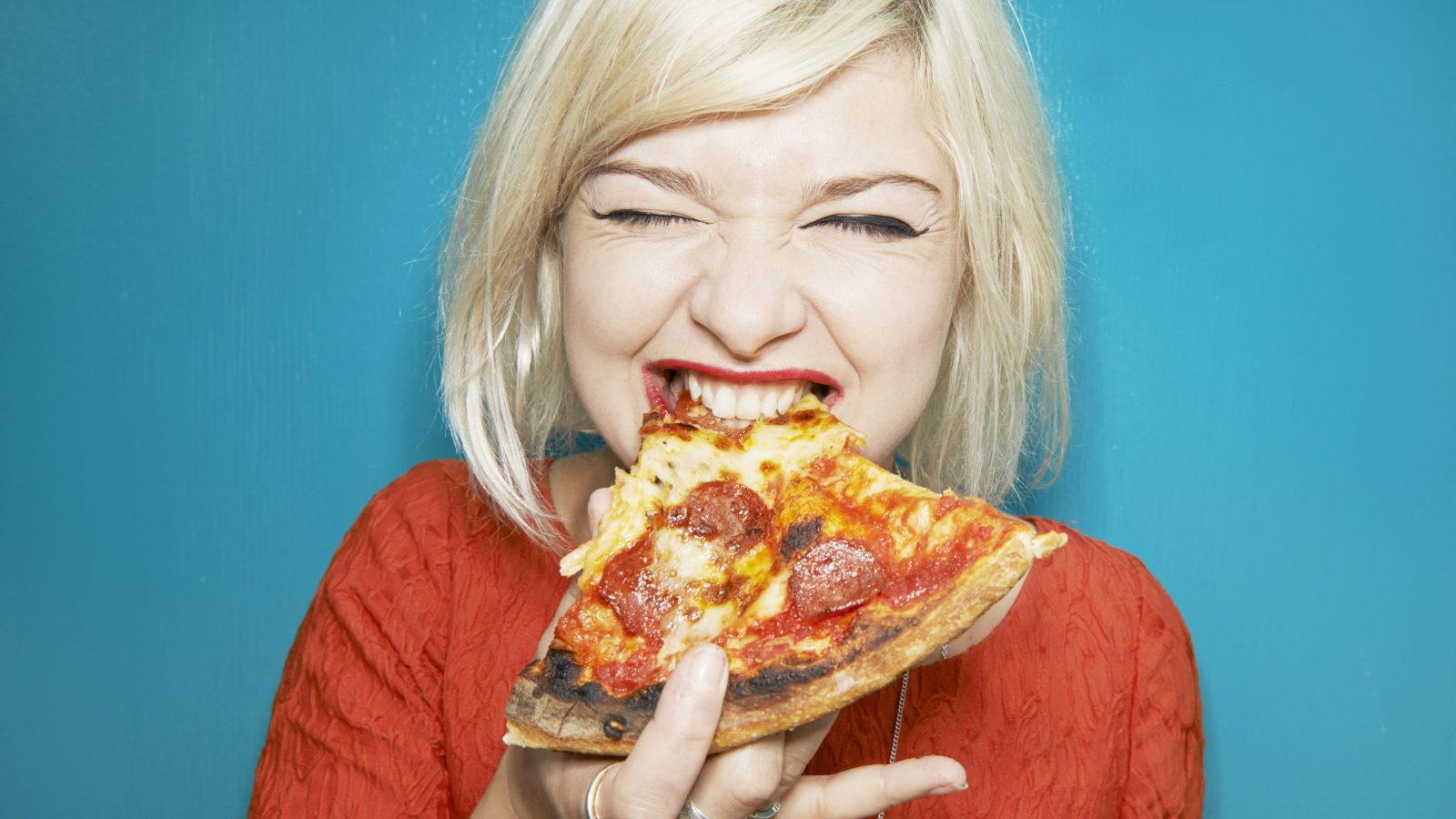 Don't Freak Out, But This Pizza Quiz Will Reveal Your Zodiac Sign Woman eating pizza