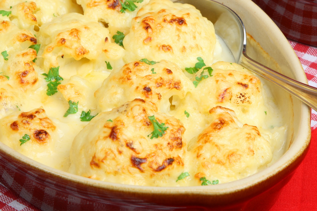 🍫 This Chocolate & Cheese Quiz Will Reveal Your Taste in Men 🧀 Cauliflower and cheese dish in ovenware