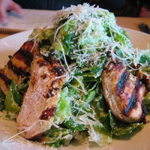 Order a Giant Meal from the Cheesecake Factory and We’ll Reveal How Old You REALLY Act Chicken caesar salad
