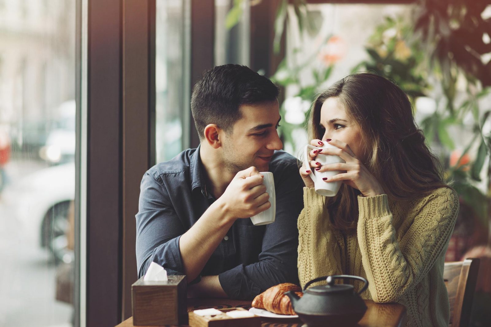 Which Coffee Chain Am I? Couple in love drinking coffee in coffee shop