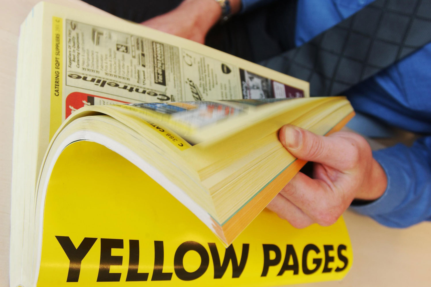 Sorry, If You Did 10/15 of These Things You’re Old Now person using yellow pages