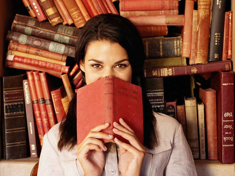 Pretend You’re in 🏫 High School Again and We’ll Reveal the Career You’d Be Really Good at person reading history book