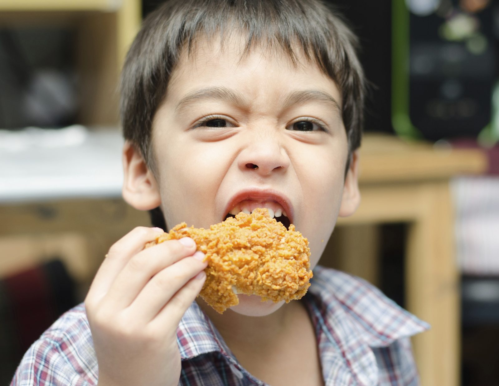 Can You Actually Get a Perfect Score on This Trivia Quiz? Little boy eating fried chicken