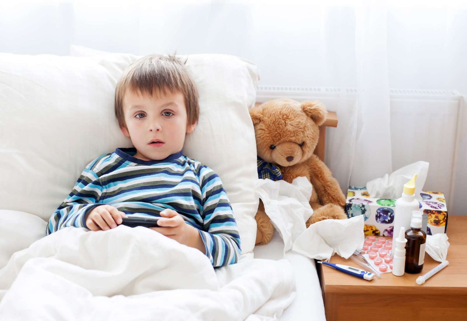 General Knowledge Quiz 🧠: Beat This 20-Question Quiz! Sick child boy lying in bed with a fever, resting