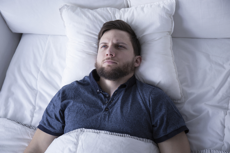 Most People Can’t Spell Half of These Words Correctly — How Well Can You Do? Man suffering from insomnia