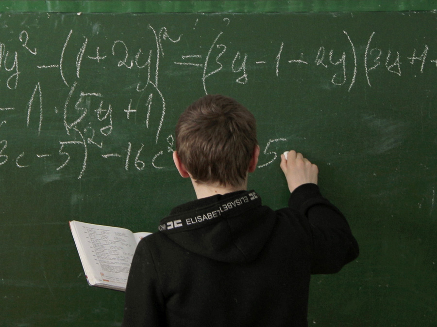 This Quiz Will Reveal If You Aced or Flunked Out of High School person doing math