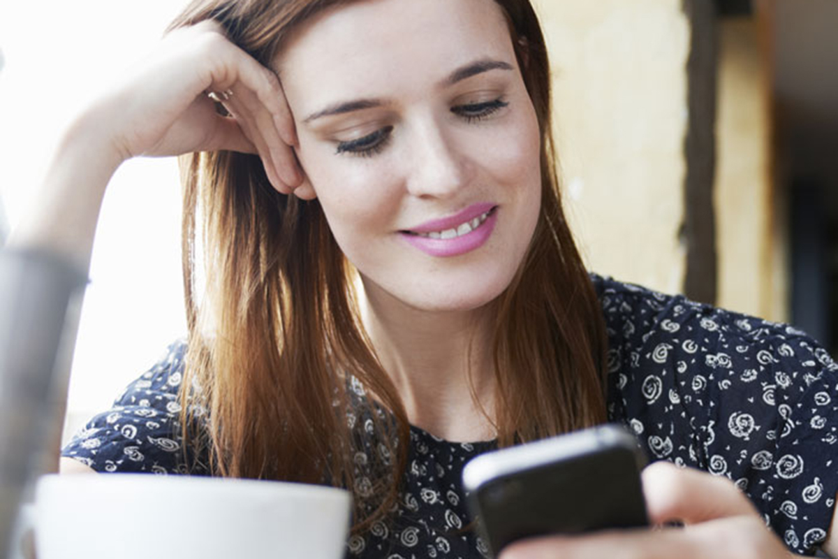 Respond to These Texts and We’ll Reveal Your True Emotional Age person happily texting