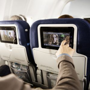 ✈️ Your Airplane Habits Will Reveal Whether You Are a Seasoned Traveler Watching shows on a mobile device, laptop, or in-flight entertainment