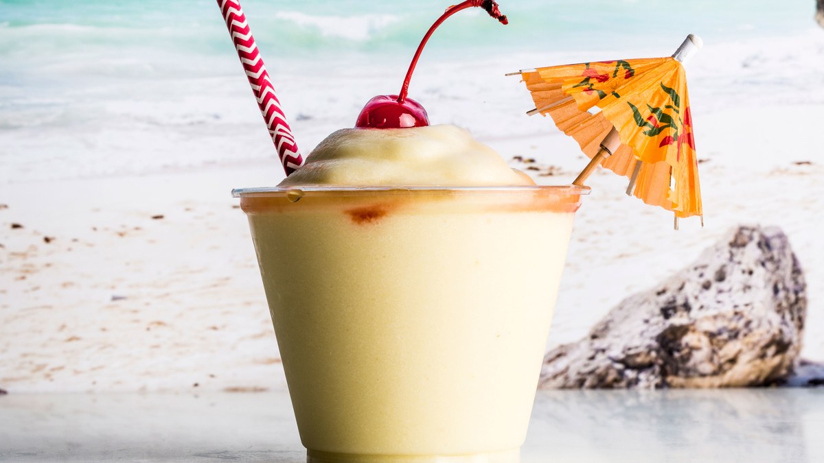 90% Of People Will Fail This Tricky General Knowledge Test. Will You? person drinking Pina Colada