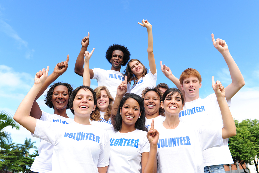Are You an Empath? portrait of a happy and diverse volunteer group hands raised