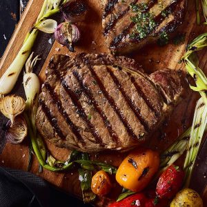 Host a Celeb Dinner Party and We’ll Guess Your Zodiac Sign Ribeye steak