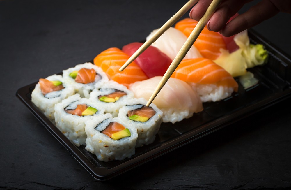 Sushi Trivia Quiz eating sushi with chopsticks