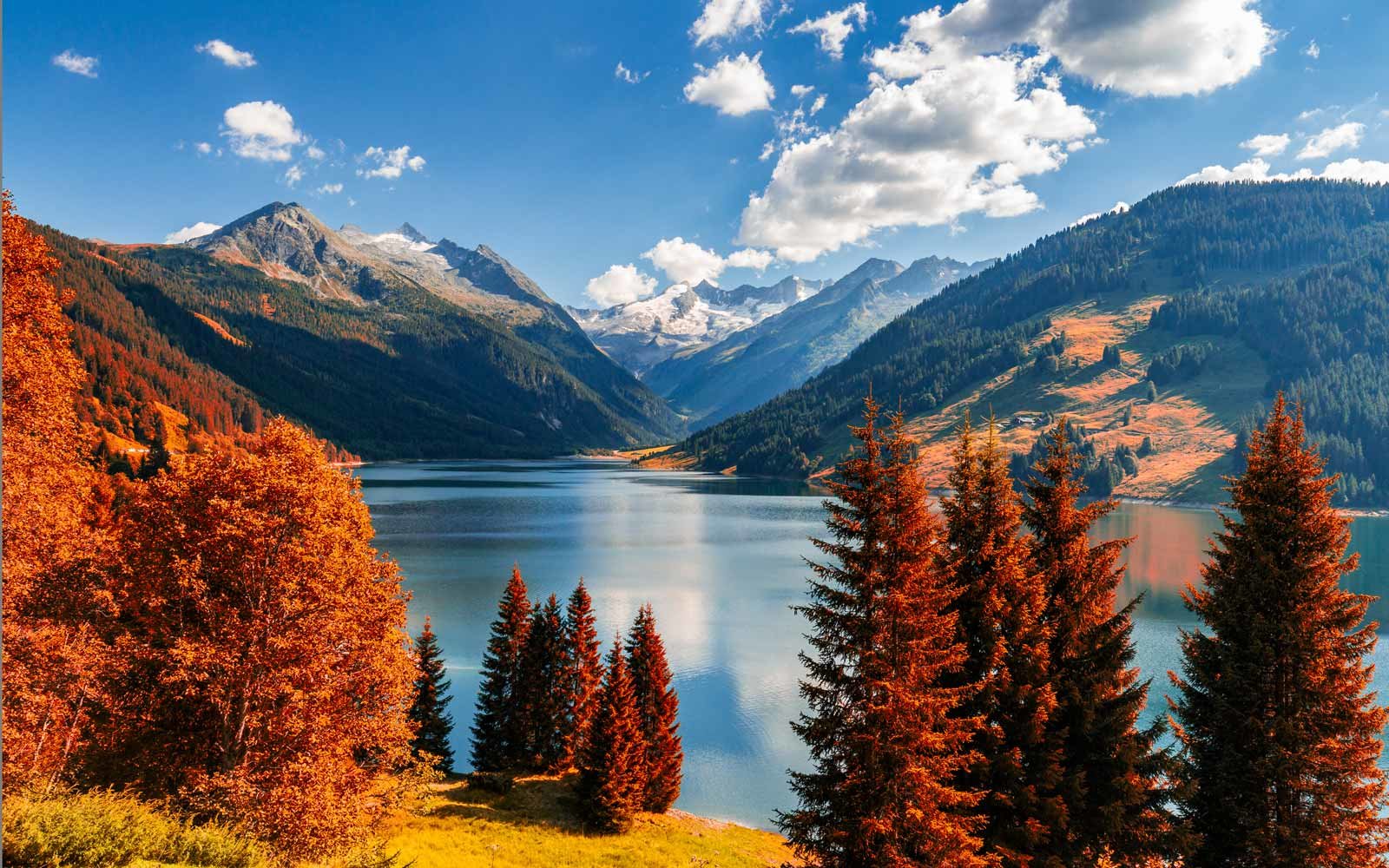 Mountains Quiz Autumn view with red foliage of the Alps with lake