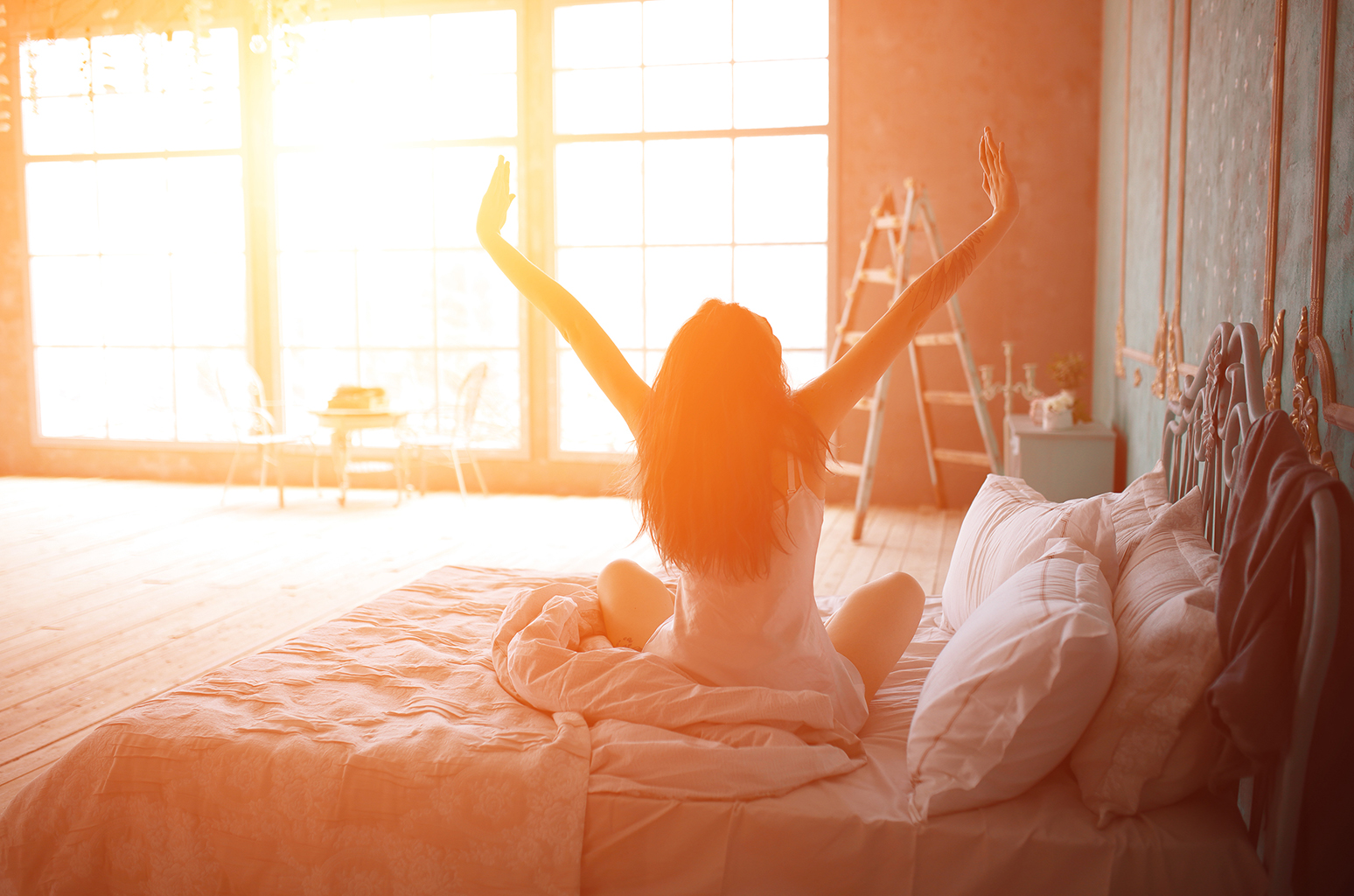 Take This Word Association Quiz to Know If You’re Actually Fun or Really Boring Woman stretching in bed after wake up