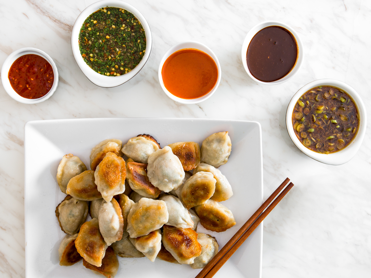 Order Chinese Food to Know What Your Fortune Cookie Says Quiz dipping dumplings in sauce