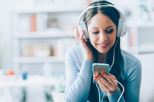 Soulmate Quiz Girl listening to music with her smartphone