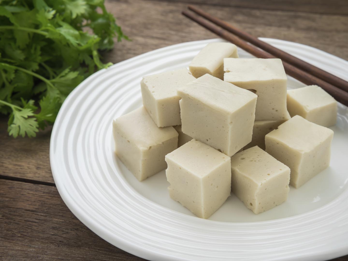 Rename These Common Foods to Find Out How Old You Are Inside Tofu cubes on plate