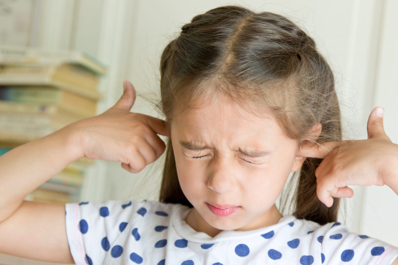 What Sound Are You? Little girl covering her ears