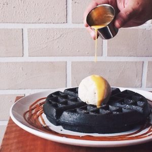 Pretend to Order an Expensive Brunch and We’ll Reveal Whether You’re More Millionaire or Billionaire Material Charcoal waffles with salted egg sauce