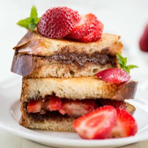 Pretend to Order an Expensive Brunch and We’ll Reveal Whether You’re More Millionaire or Billionaire Material Chocolate French toast with strawberries