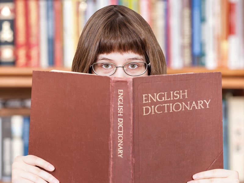 Is Your Vocabulary Better Than the Average Person? person reading dictionary