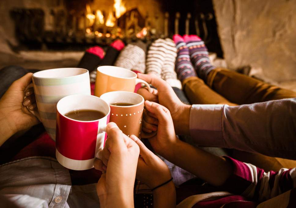 person drinking hot chocolate at night