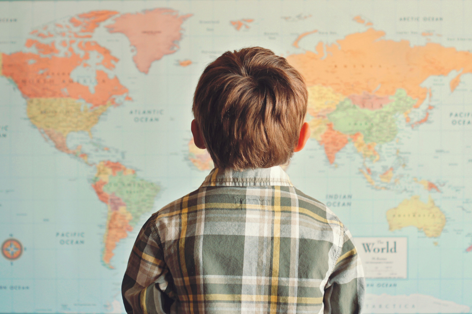 Only 56% Of Adults Can Pass This General Knowledge Test Boy looking at world map
