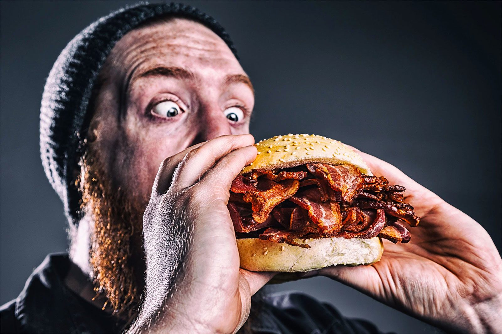 Man Eating Bacon Burger