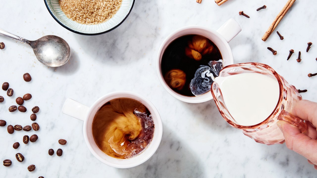 Pouring Milk In Coffee