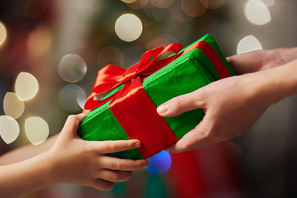 Your Choices on This Quiz Will Reveal How 😢 Sensitive You Are parent giving christmas gift to child