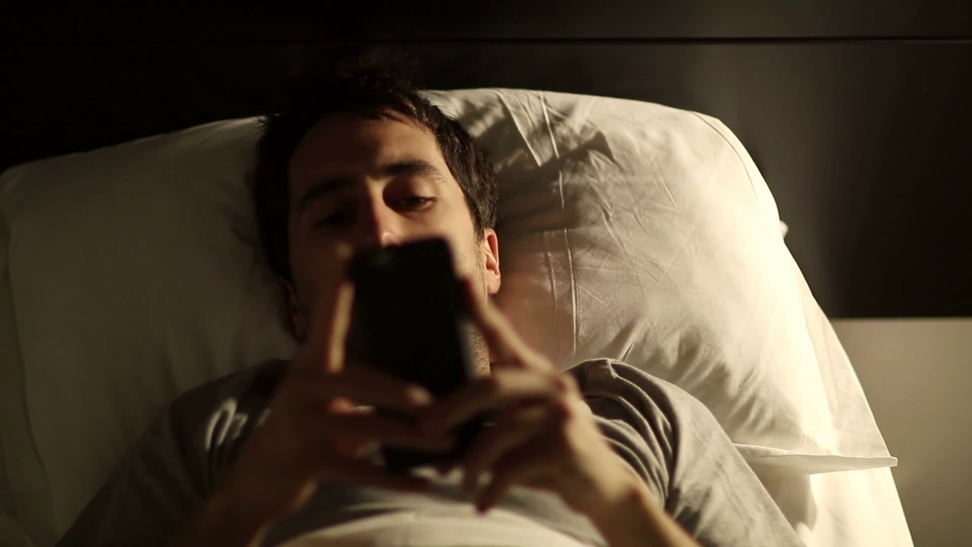 What Zombie Are You? person using cellphone in bed man using smartphone mobile cellphone in bed _bdgkn8u8ue_thumbnail full01