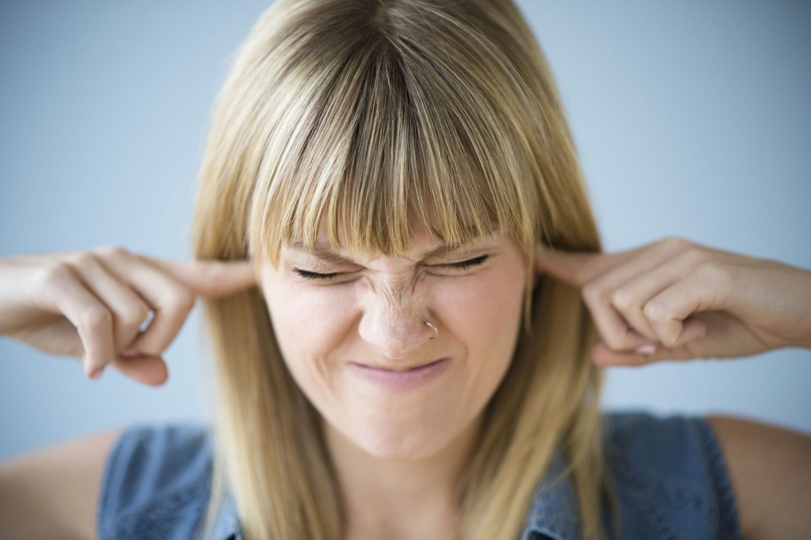 Woman Annoyed By Loud Noise