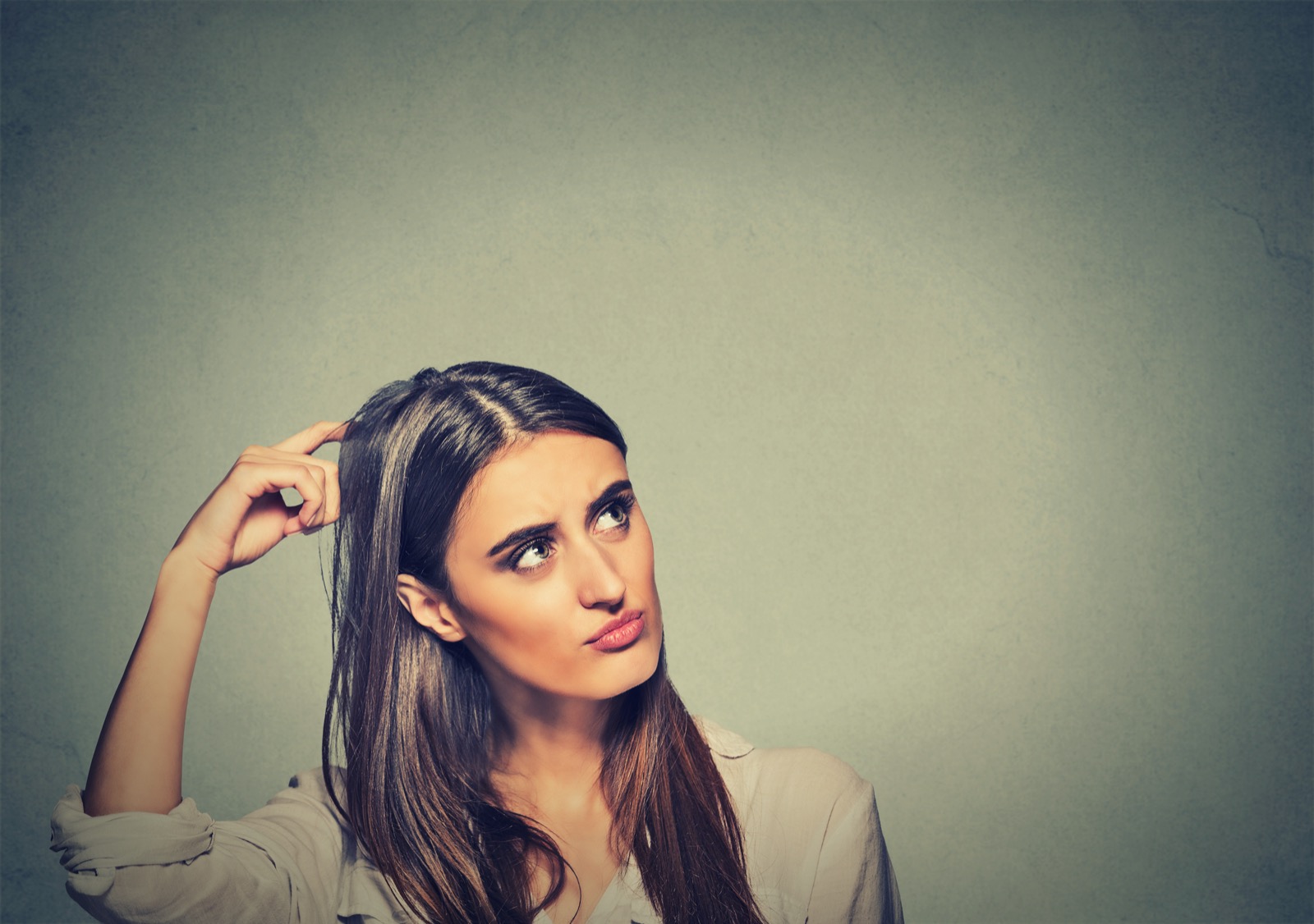 Can We Guess the Generation You’re from Based on How You Define These Words? Contused Thinking Woman Bewildered Scratching Her Head Seeks A Solution