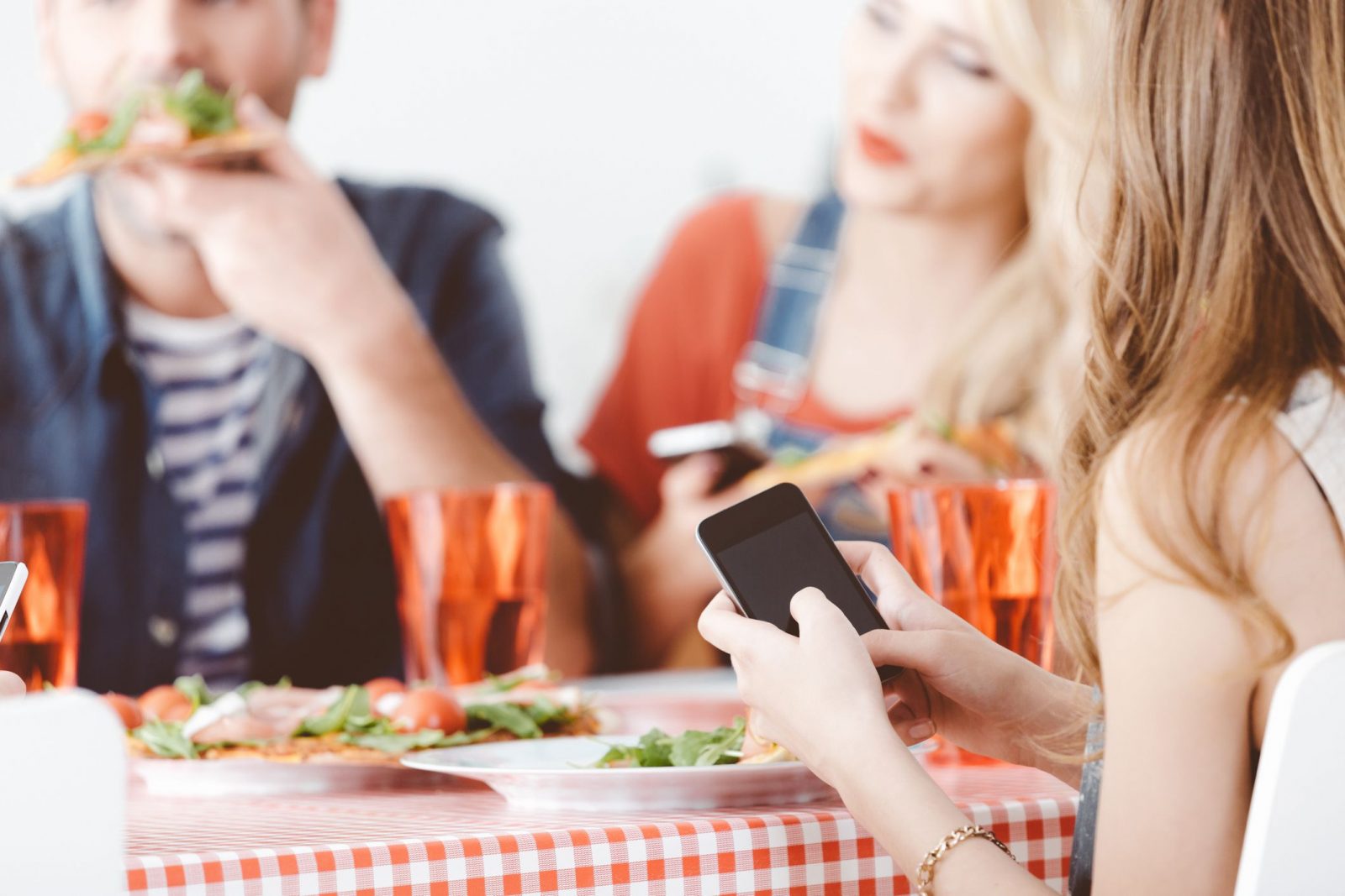 Respond to These Texts and We’ll Reveal Your True Emotional Age Friends Using Phone At Meal