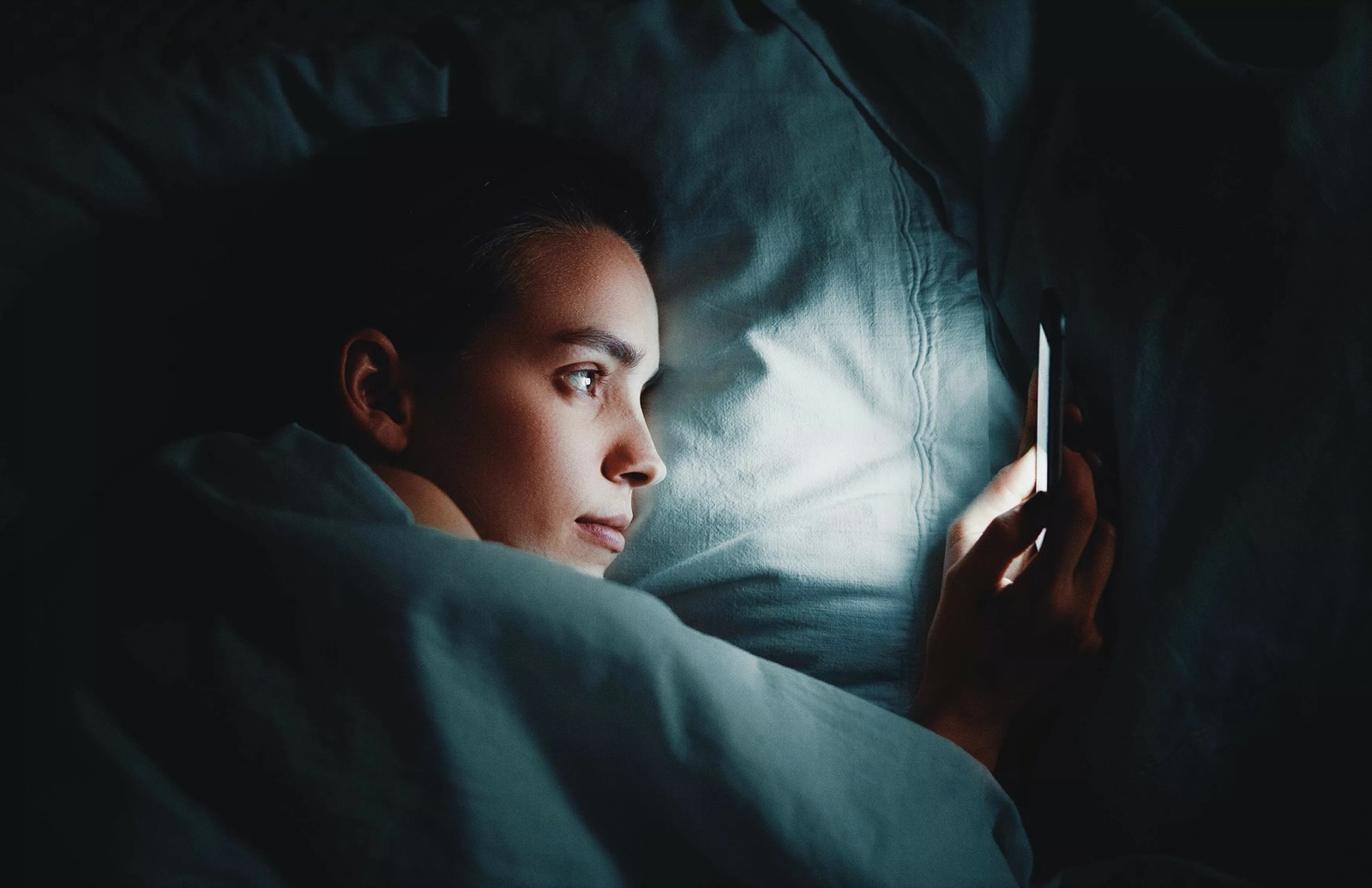 What Is Your Your Inner Goddess? Woman Using Phone In Bed At Night Sleep