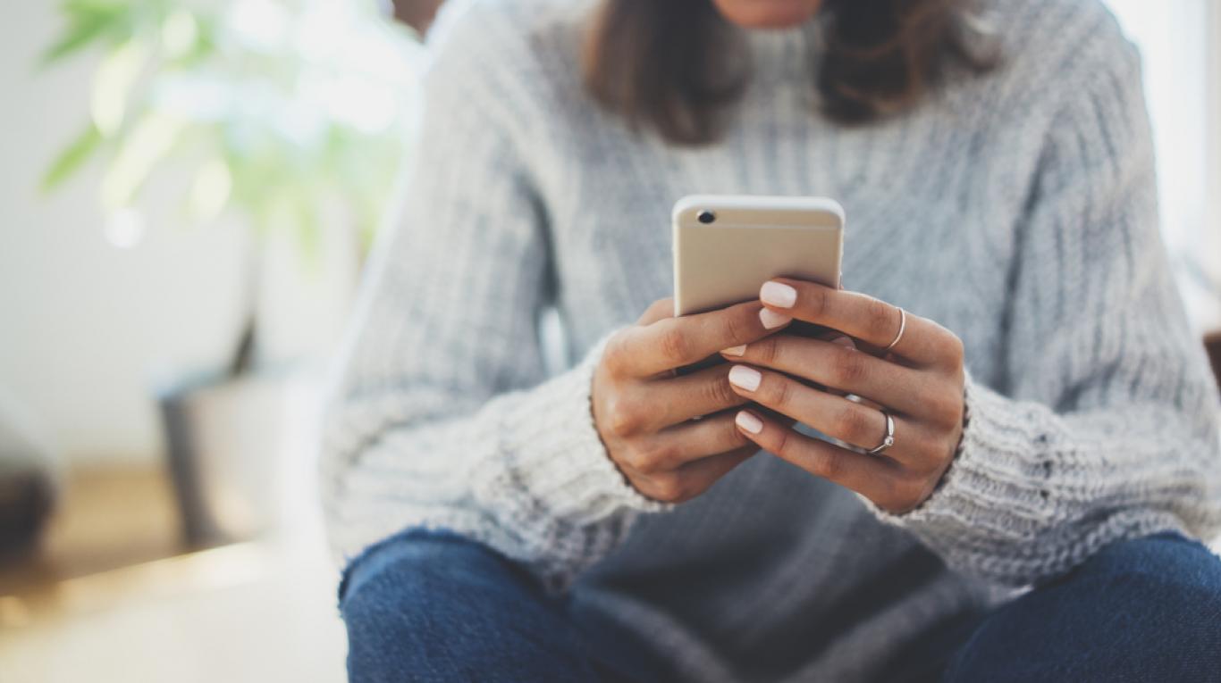 Respond to These Texts and We’ll Reveal Your True Emotional Age Woman On Phone 3
