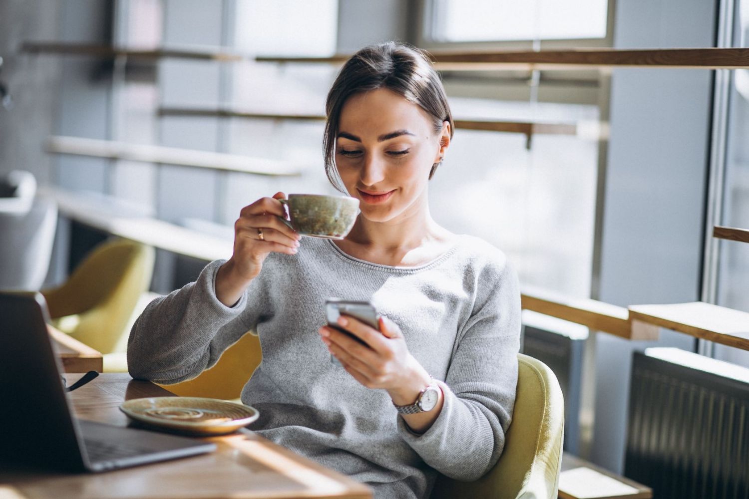 What Kind of Friend Are You? Reply to These Texts to Find Out Woman Using Phone With Coffee