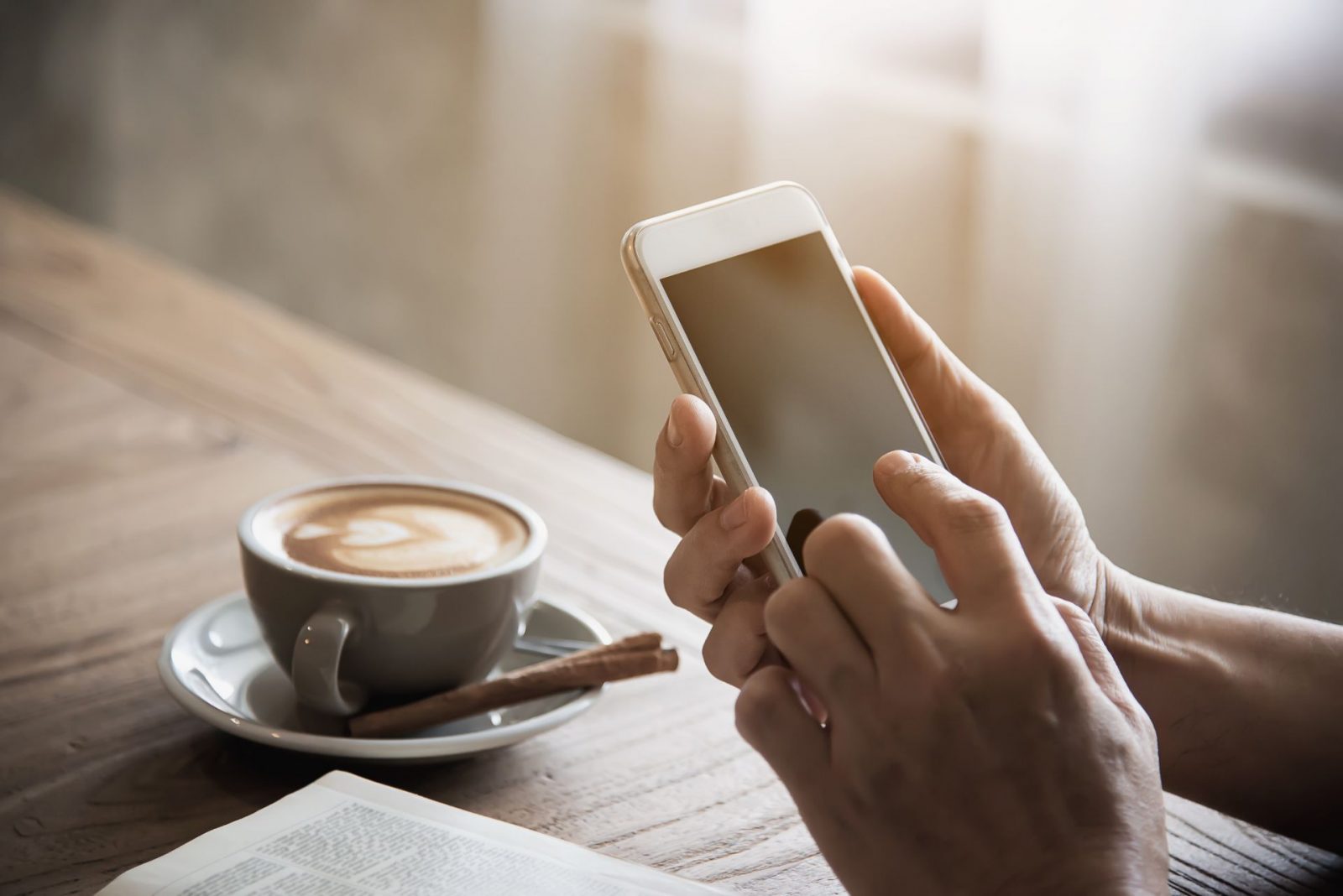 Respond to These Texts and We’ll Reveal Your True Emotional Age Using Phone With Coffee