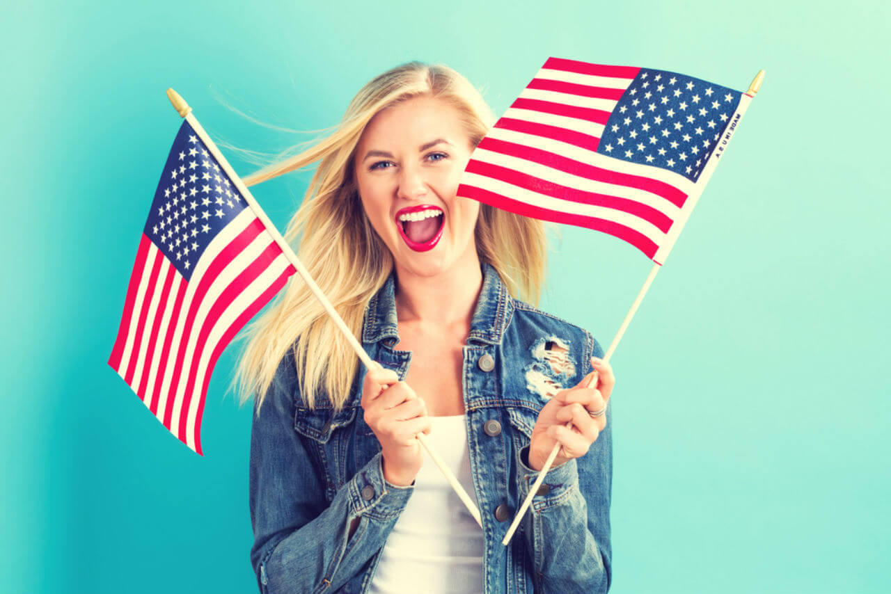 Passing This Geography Quiz Means You Have a Ton of Knowledge Woman Holding United States Flag