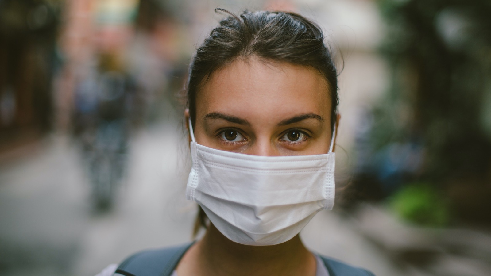 If You Can Score More Than 10/15 on This Coronavirus Quiz, You’re Probably a Doctor Woman Wearing Surgical Mask